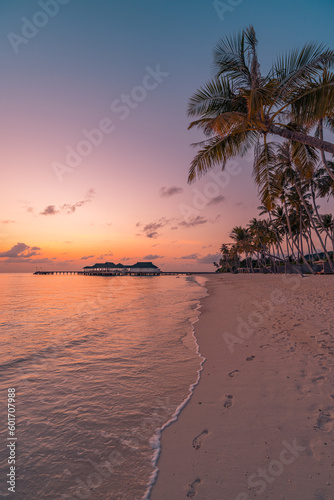 Fantastic closeup view of calm sea water waves with orange sunrise sunset sunlight. Tropical island beach landscape  exotic shore coast. Summer vacation  holiday amazing nature scenic. Relax paradise