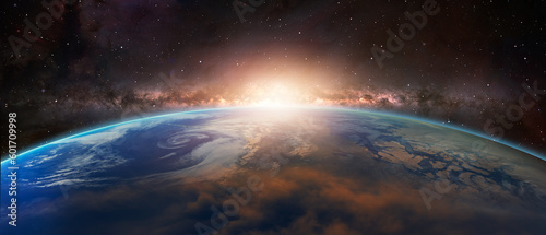 Fototapeta Naklejka Na Ścianę i Meble -  View of the planet Earth from space during a sunrise against milkyway galaxy 