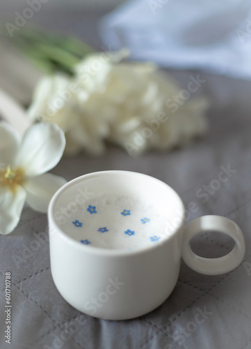 A cup of aromatic coffee and flowers