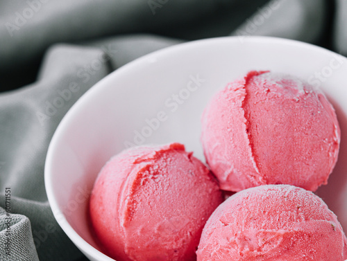 Tasty raspberries ice-cream balls in bowl
