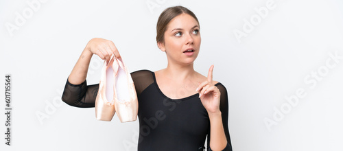 Fototapeta Naklejka Na Ścianę i Meble -  Young beautiful blonde woman practicing ballet isolated on white background thinking an idea pointing the finger up