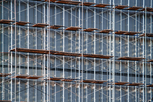 Facade work using multi-level scaffolding.