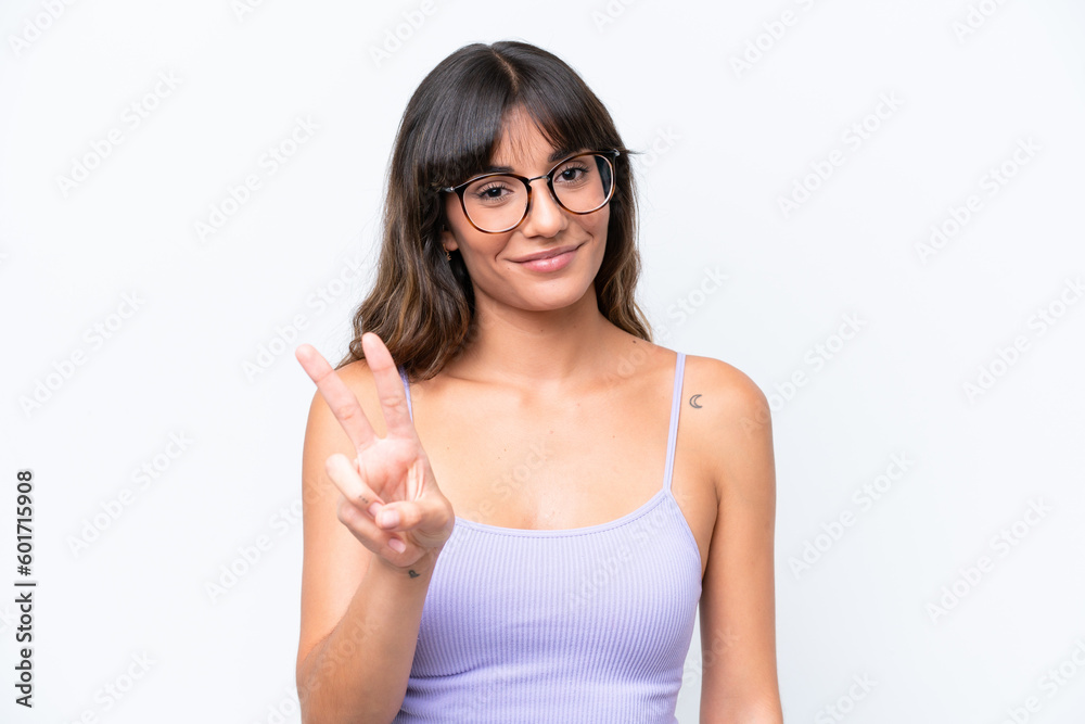 Young caucasian woman over isolated background With glasses and doing OK sign