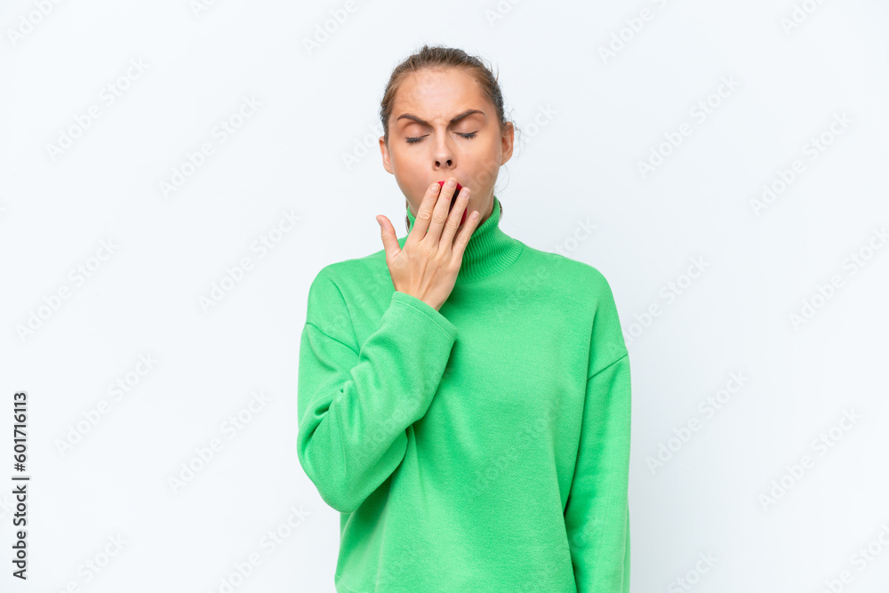 Young caucasian woman isolated on white background yawning and covering wide open mouth with hand Young caucasian woman isolated on white background yawning and covering wide open mouth with hand