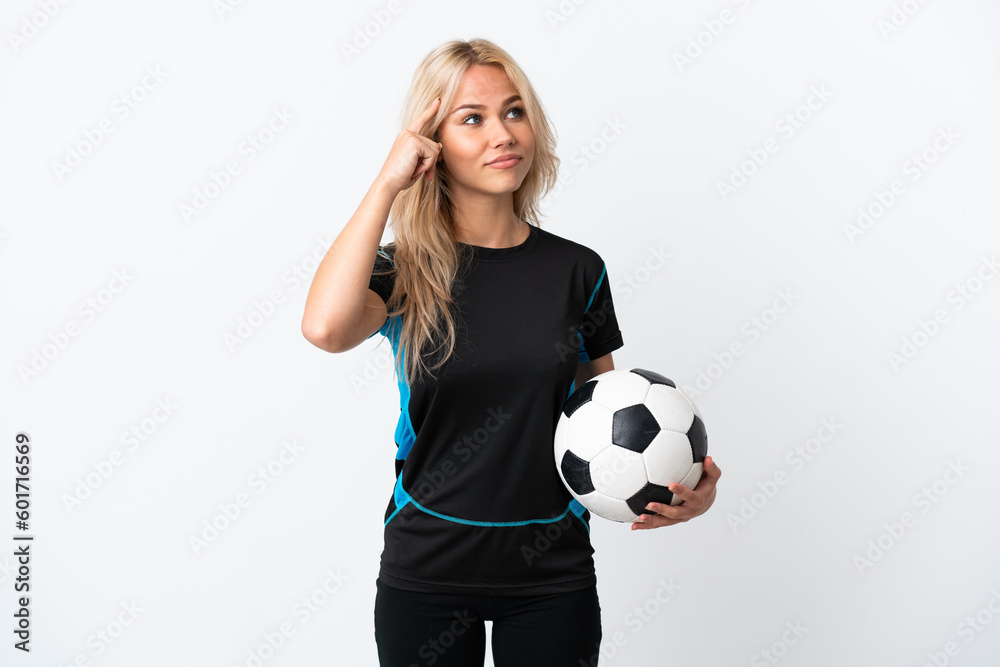 Young Russian woman playing football isolated on white background having doubts and thinking Young Russian woman playing football isolated on white background having doubts and thinking