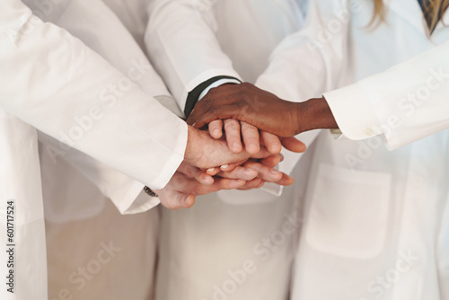 Doctors Teamwork in Action: Close-Up of United Hands in Lab Coats, Medical professional collaborating.