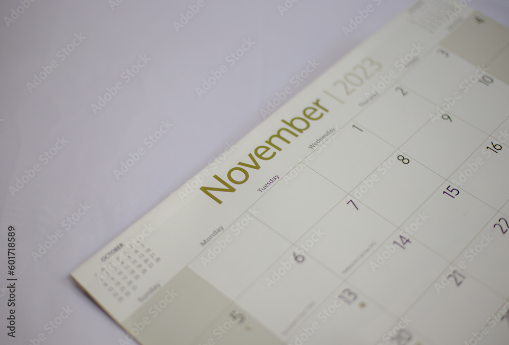 Selective focus shot of a closeup calendar of November 2023. November 2023 calendar isolated on background. Selective focus shot of a closeup calendar of November 2023. November 2023 calendar isolated on background.