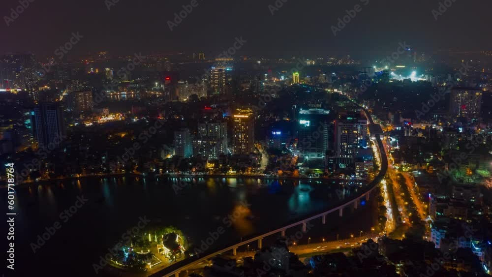 HANOI, VIETNAM - MAY, 2023: Night aerial drone view timelapse of a city streets in downtown nightlife traffic from a top view. HANOI, VIETNAM - MAY, 2023: Night aerial drone view timelapse of a city streets in downtown nightlife traffic from a top view.