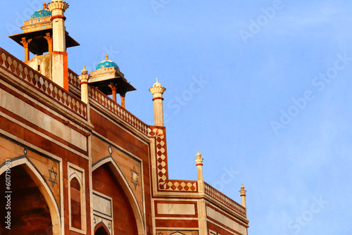 beautiful blue sky and Humayun's tomb of Mughal Emperor Humayun designed by Persian architect Mirak Mirza Ghiyas in Delhi, India. Tomb was commissioned by Humayun's wife Empress Bega Begum in 1569-70 photo