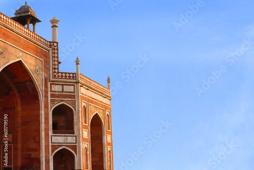 beautiful blue sky and Humayun's tomb of Mughal Emperor Humayun designed by Persian architect Mirak Mirza Ghiyas in Delhi, India. Tomb was commissioned by Humayun's wife Empress Bega Begum in 1569-70 photo