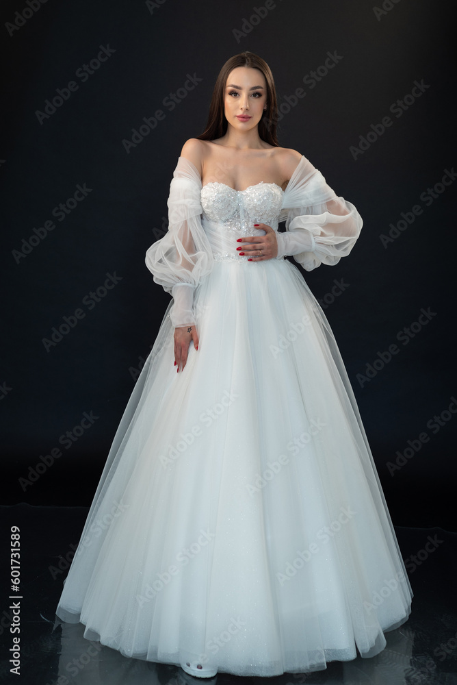 Perfect bride in wedding dress on black background Perfect bride in wedding dress on black background
