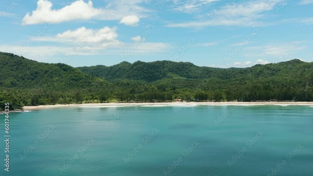 Aerial view of coastline with beautiful sandy beach and blue sea. Sabah, Borneo, Malaysia. Aerial view of coastline with beautiful sandy beach and blue sea. Sabah, Borneo, Malaysia.
