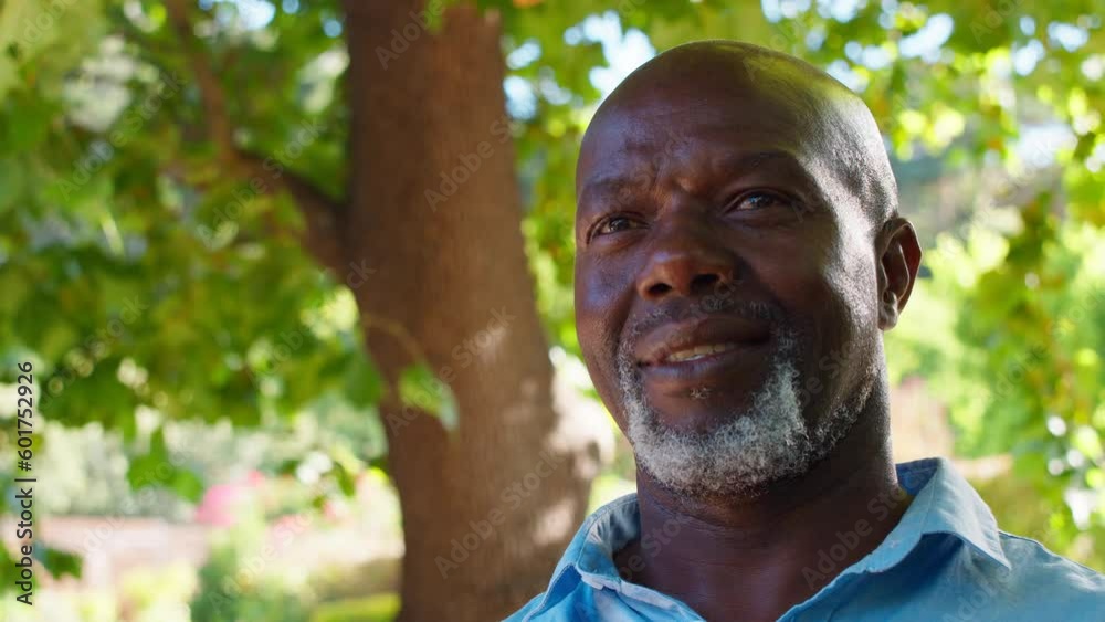 Portrait of serious senior man outside in park, garden or countryside - shot in slow motion Portrait of serious senior man outside in park, garden or countryside - shot in slow motion