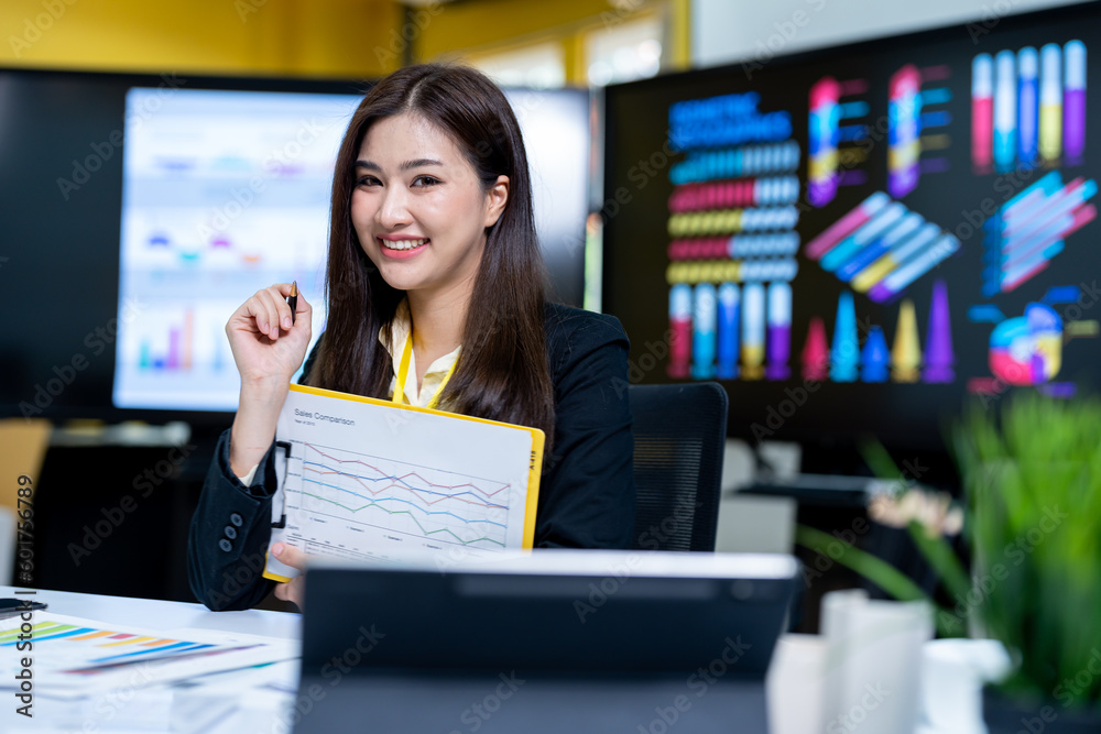 Smiling businesswoman working together on contract document, happy colleague meeting for planning new project in office Smiling businesswoman working together on contract document, happy colleague meeting for planning new project in office