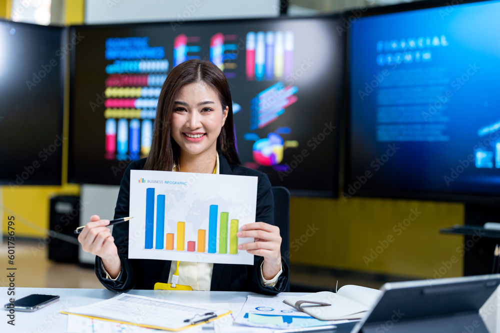 Young successful employee business woman in black shirt hold paper account document work stand at workplace white desk with laptop pc computer at light modern office indoors achievement career concept Young successful employee business woman in black shirt hold paper account document work stand at workplace white desk with laptop pc computer at light modern office indoors achievement career concept