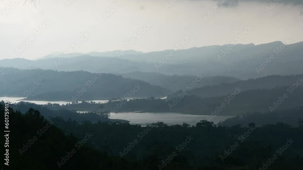 Indonesia's tropical forest landscape is foggy because it will rain