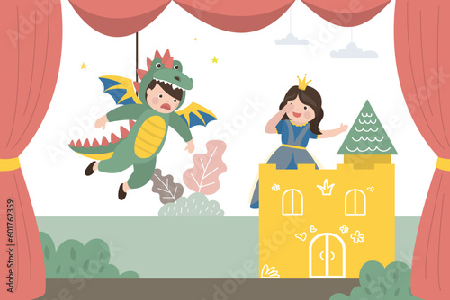 Boy dressed as monster and girl dressed as beautiful princess. Children play in school theater, dragon attacks the castle. Theatrical performance, small actors on stage.
