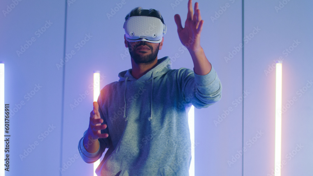 Young Middle East man putting on Virtual Reality headset for first time ...