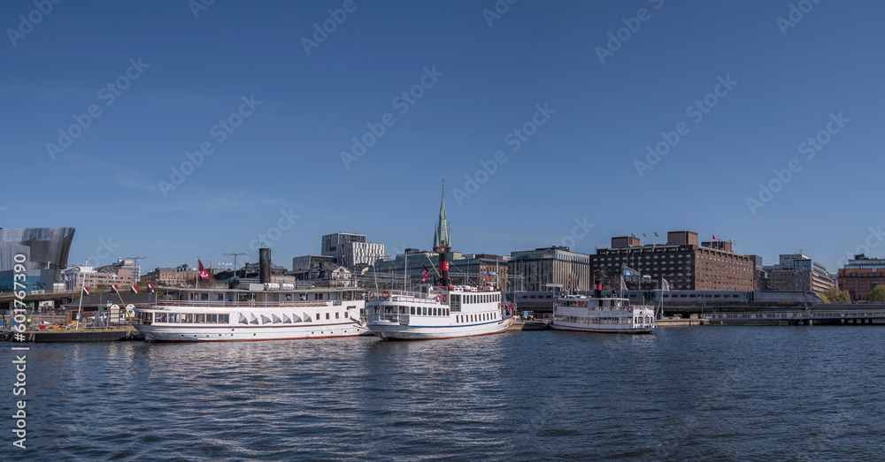 Old SS Motala Express steam boat moored at a pier, an sunny early summer day in Stockholm 