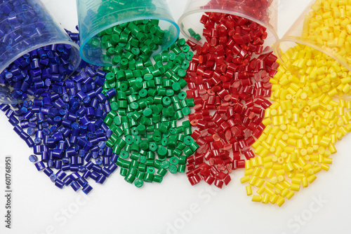 Colored plastic resins in glass test glasses in laboratory photo