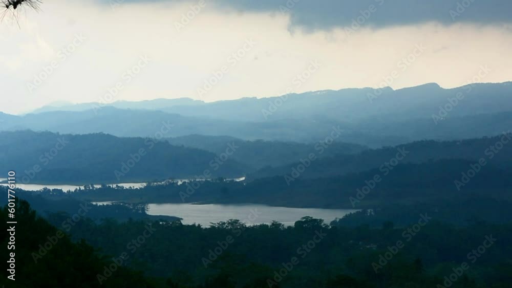 Indonesia's tropical forest landscape is foggy because it will rain