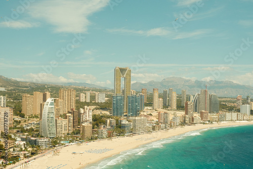 Panoramic view of Benidorm Poniente beach. Cityscape of Benidorm city with beach, skyscrapers, hotels and turquoise blue Mediterranean Sea. Aerial view