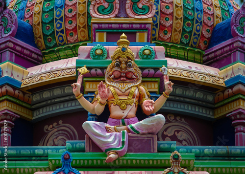 Temple tower with Hindu god lord Vishnu in Narasimha avatar (lion face) photo