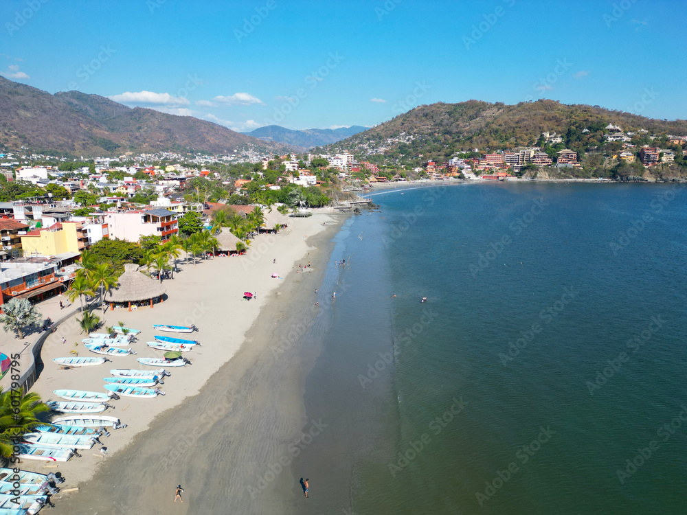 Aerial View of Zihuatanejo Beach: Sand, Water, Trees, and Boats
