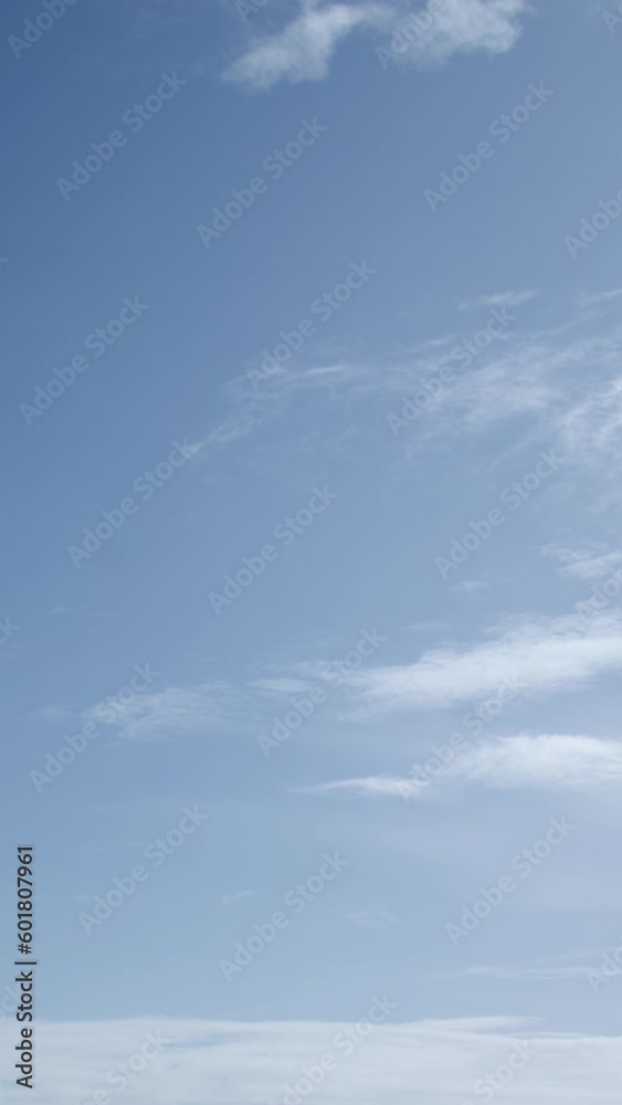 Cirrocumulus clouds are thin, sometimes patchy, sheet-like clouds. Vertical video. Cirrocumulus clouds are thin, sometimes patchy, sheet-like clouds. Vertical video.