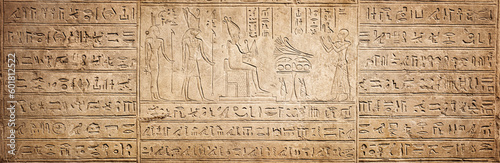 Fotografiet Old Egyptian hieroglyphs on an ancient background