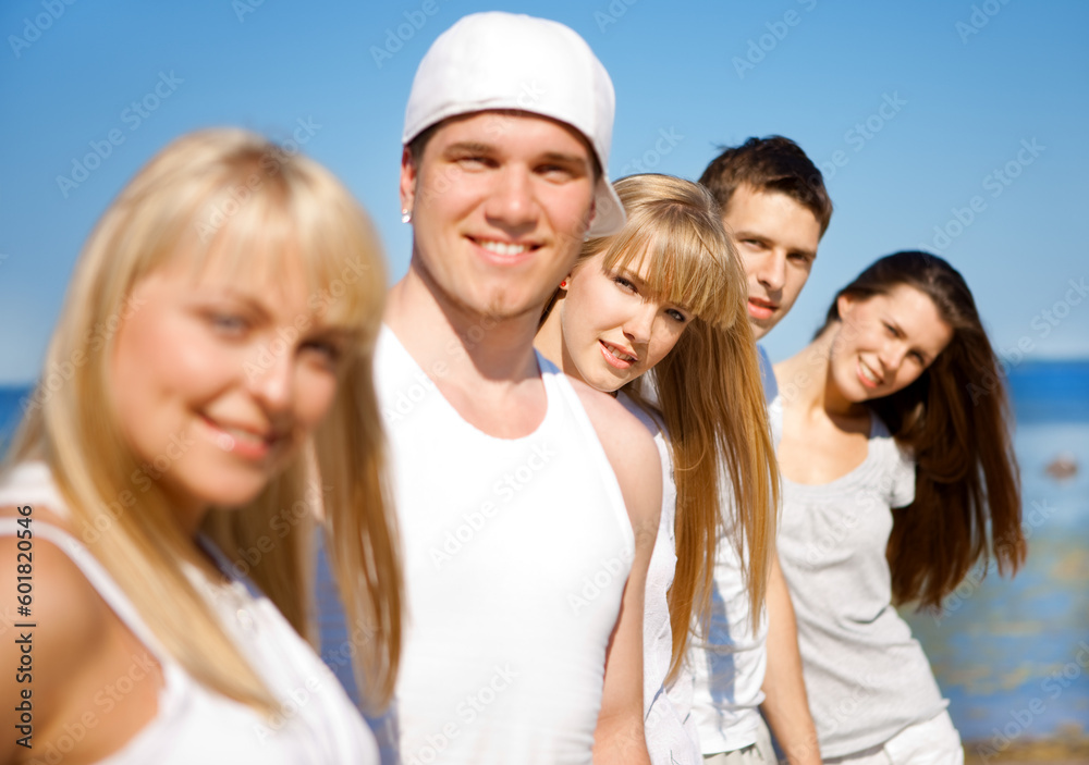 Five young people enjoying summer together (focus on the girl in the middle) Five young people enjoying summer together (focus on the girl in the middle)