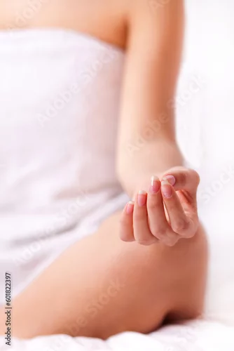 Obraz Close up shot of a young girl fingers while yoga over white isolated background