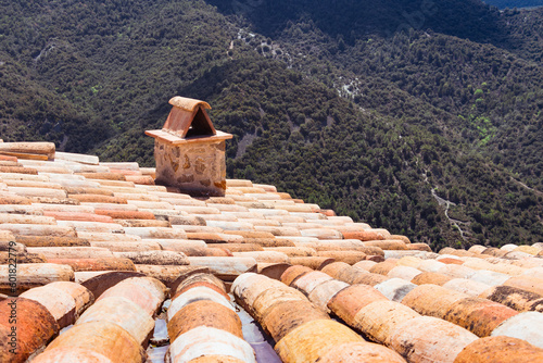 Roof terracotta tiles on a house in Siurana, Spain. View of the valley