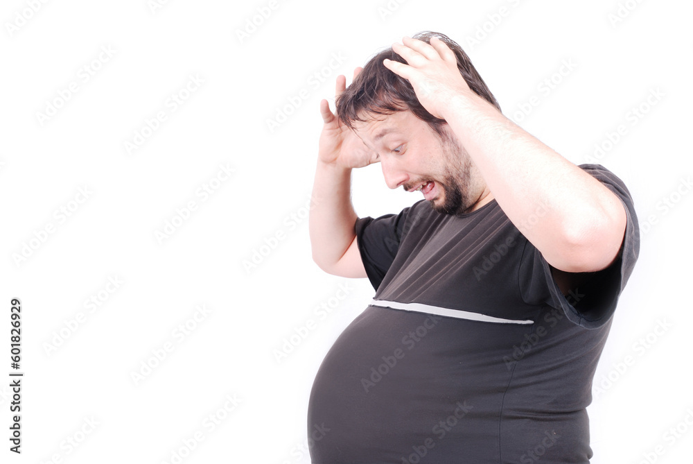 Pragnant man with big stomach with surprised expression on face Pragnant man with big stomach with surprised expression on face