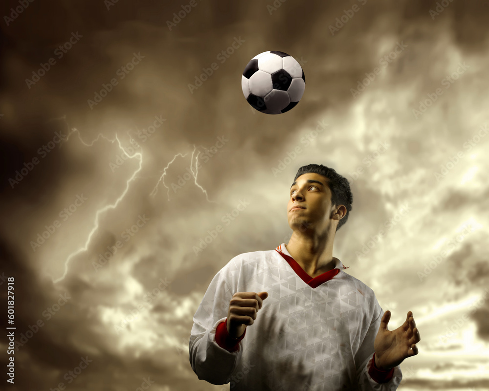 soccer or football  player against a stormy sky