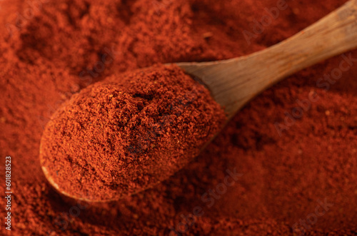 Paprika in a beautiful wooden spoon. Close-up. Macro photography. View from above