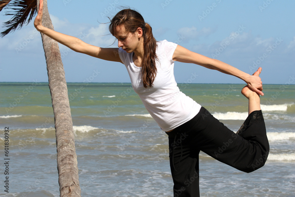 stretching and balancing exercise on the beach stretching and balancing exercise on the beach