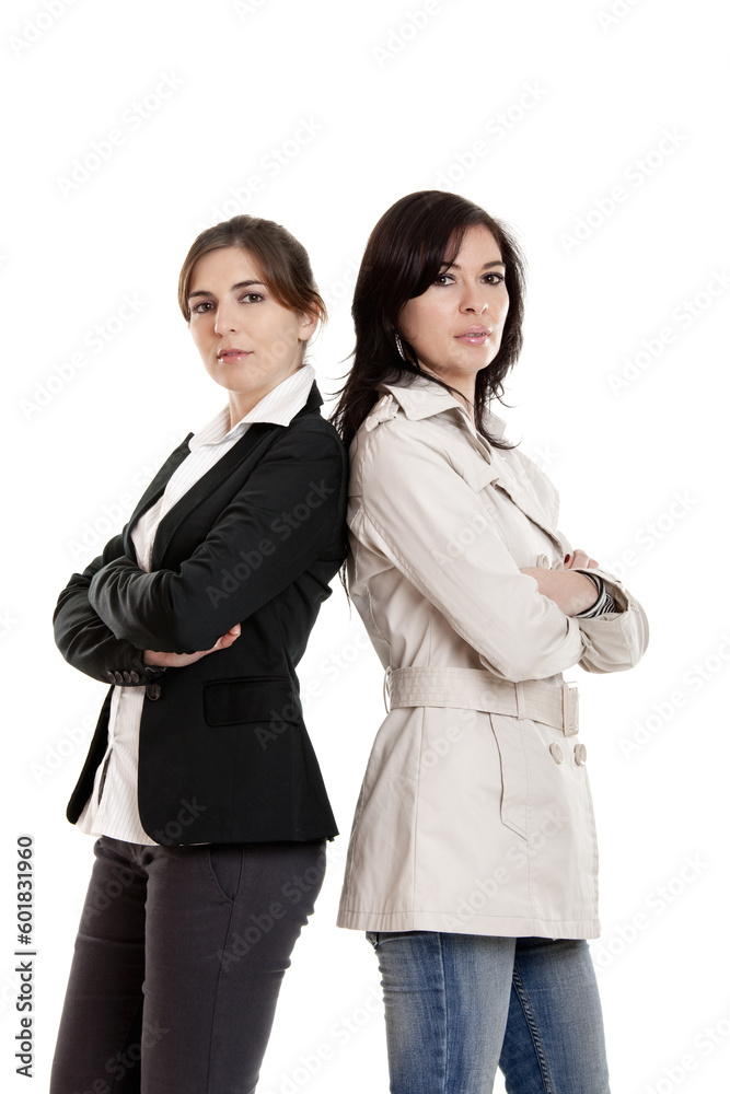 Two young modern women standing over a white background Two young modern women standing over a white background