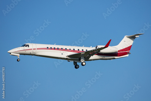Photography A modern VIP corporate jet in the air with blue sky