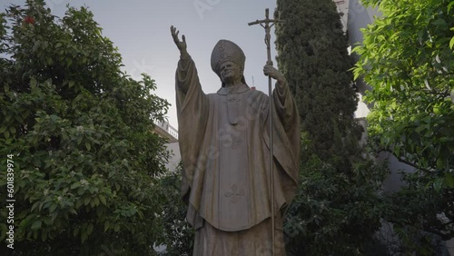 Pope John Paul II statue in front of Catedral de Sevilla Santa Maria de la Sede Seville, Spain