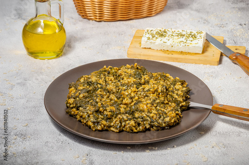 Spanakorizo Greek dish of spinach and rice  in tomato sauce photo