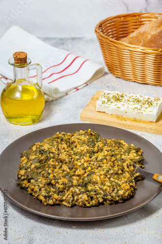 Spanakorizo Greek dish of spinach and rice  in tomato sauce photo