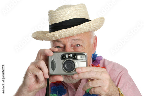 A senior man on vacation snaping photographs. photo