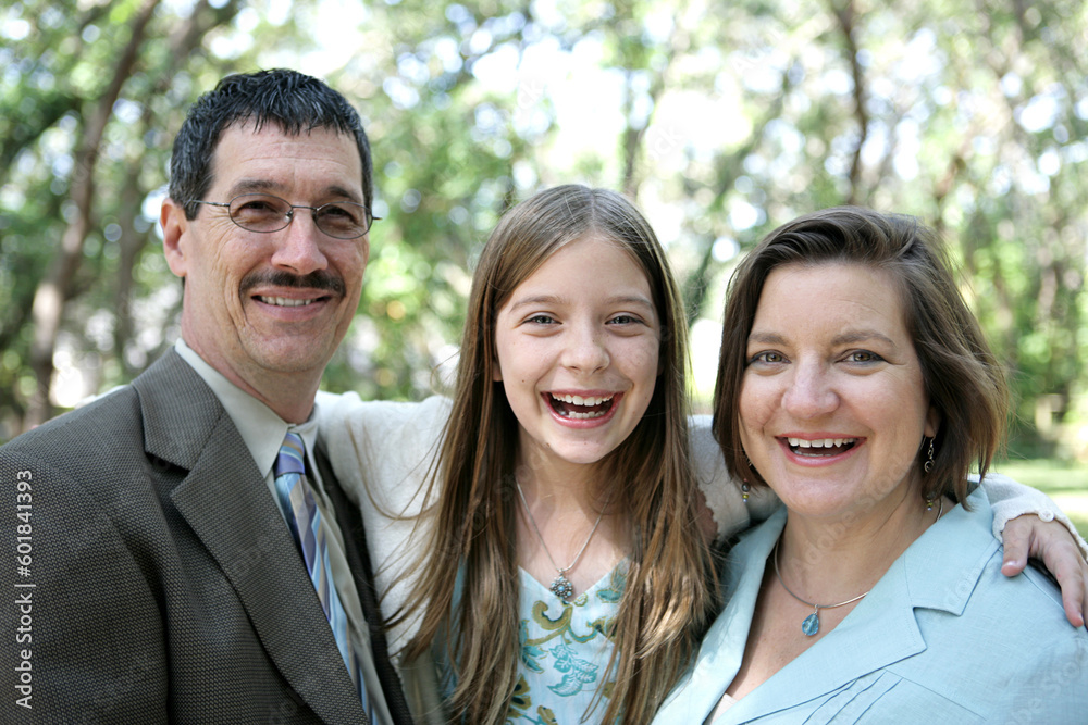 A happy family laughing together. Focus on mom & daughter. A happy family laughing together. Focus on mom & daughter.