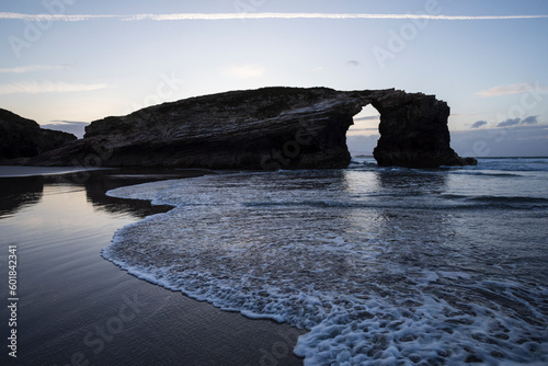 Beach of the Cathedrals in Ribadeo, Lugo, Galicia. Also called Augas Santas beach. Cliffs and stone arches. nature monument. photo