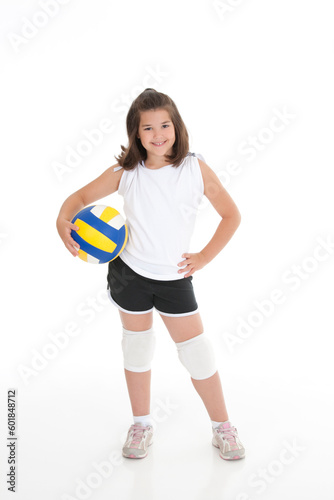 Portrait of a cute eight year old girl in volleyball outfit
