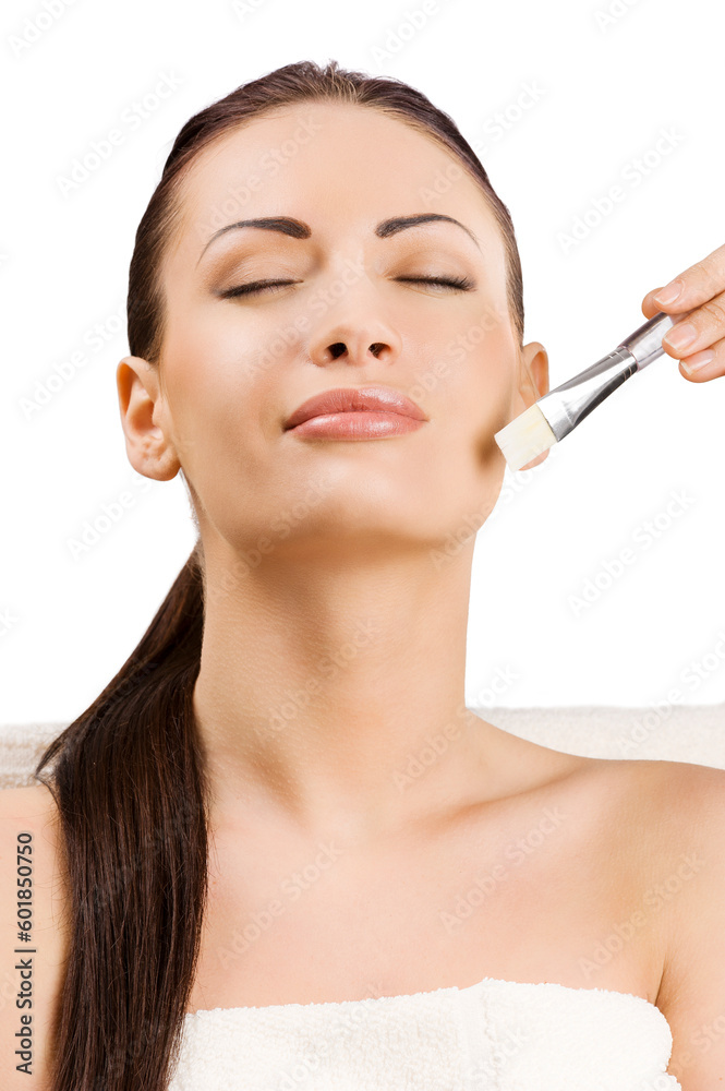 beauty advertising portrait of brunette girl getting a treatment with a brush