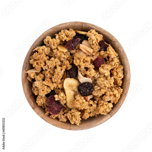 Fotografie crunchy granola in wooden bowl isolated on white, muesli pile with nuts, cranber