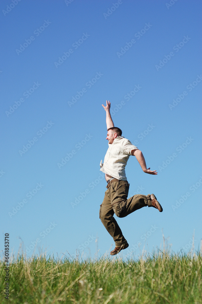 happy man jumping on sky background happy man jumping on sky background