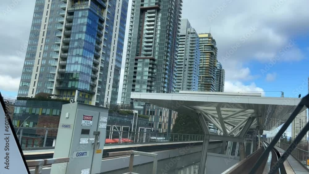 Shooting from the front window of skytrain, he passes under the bridges